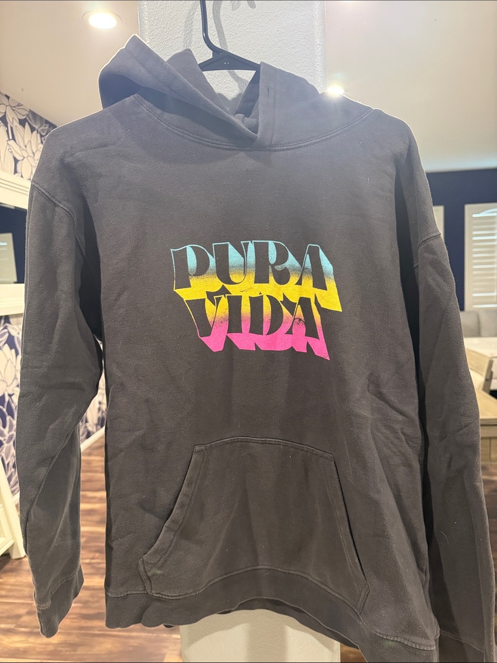 Pura Vida Black Hoodie with Blue-Yellow-Pink Gradient Logo
